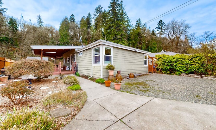 Dog-friendly riverfront home with patio, golf nearby, enclosed yard, & W/D