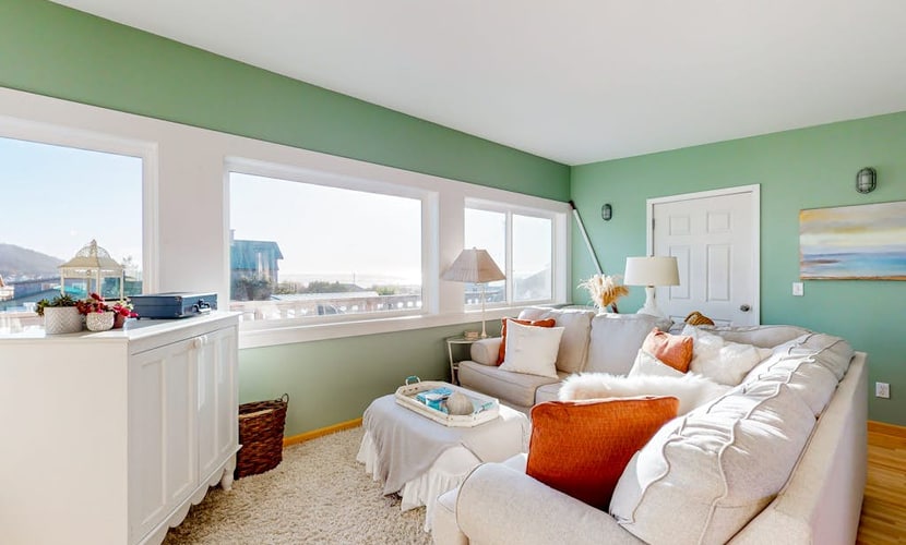 Dog-friendly condo 1 block from beach with ocean view, fireplace, balcony, & W/D