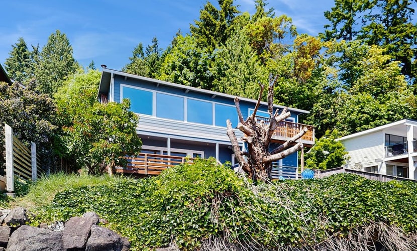 Tranquil waterfront getaway with inviting outdoor decks & beach access
