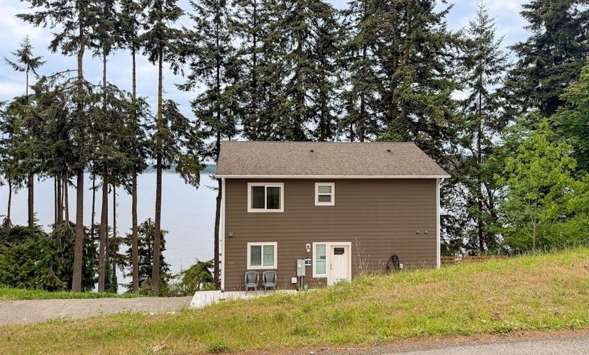 Beachfront 3-story home w/deck, bay views, hot tub, game room, WiFi, EV charger