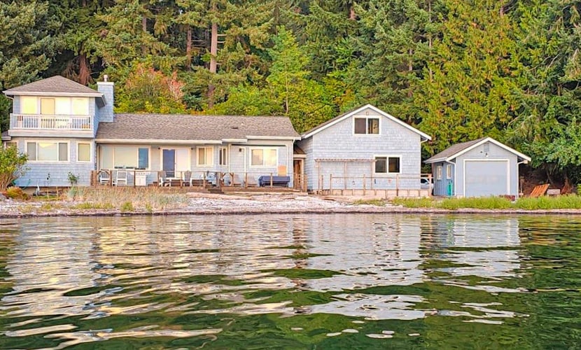 Large waterfront beach house with hot tub, game room, & private beach access