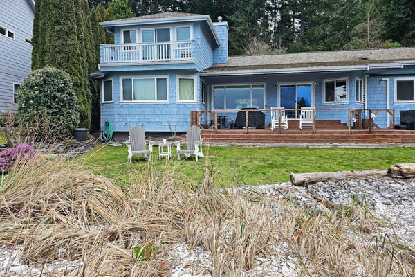 Large waterfront beach house with hot tub, game room, & private beach access