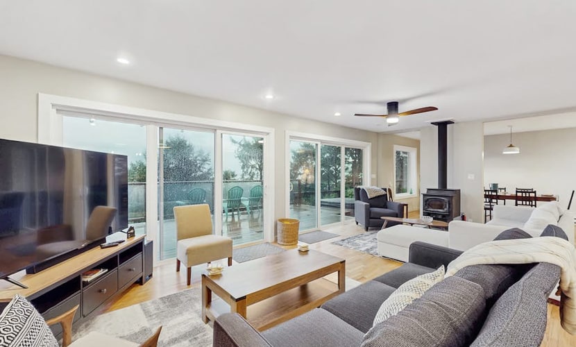 Modern ocean view home with private hot tub, big deck, and family-ready spaces