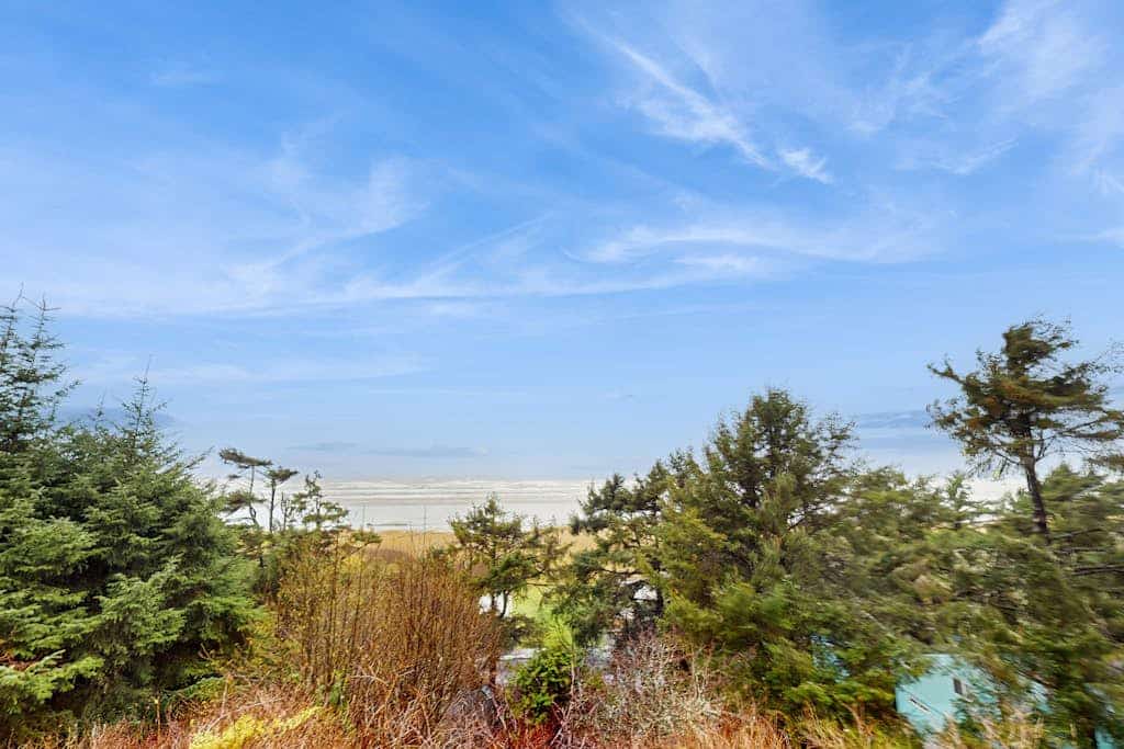 Modern ocean view home with private hot tub, big deck, and family-ready spaces