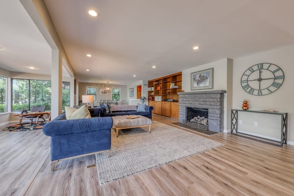 Waterfront home & on-site guest house w/ full kitchens, a large deck, & firepits
