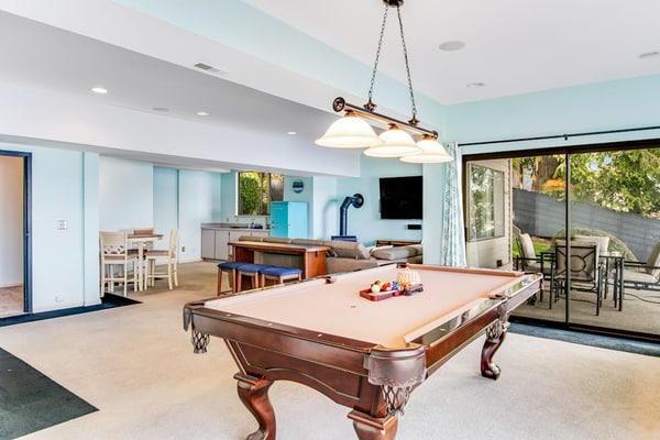 Peaceful lakefront home with firepit, hot tub, pool table, dock, balcony, & deck