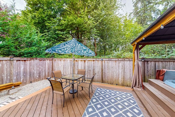 Modern lower-level getaway with a fireplace, inviting patio & washer/dryer
