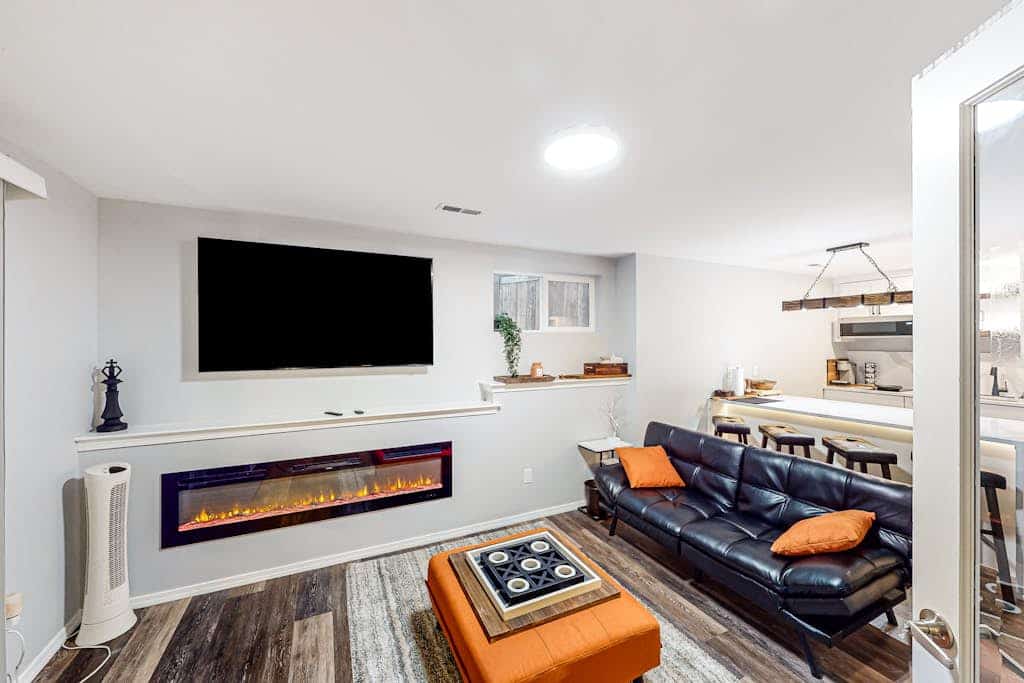 Modern lower-level getaway with a fireplace, inviting patio & washer/dryer