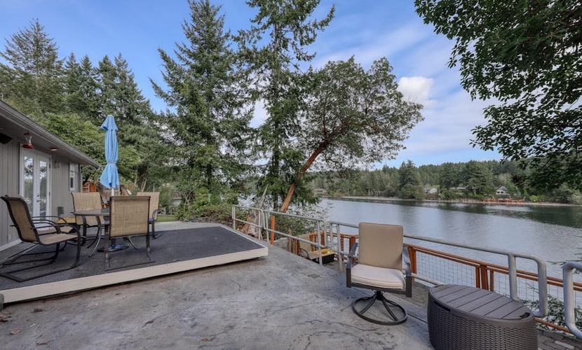 Spacious waterfront home with hot tub, large decks, kayaks, and beach access