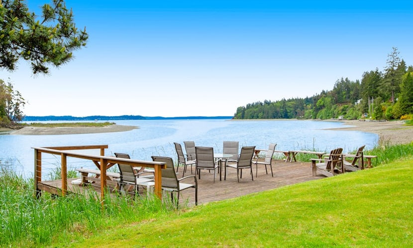 Waterfront retreat with private beach, cookhouse, hot tub, EV charger, & firepit