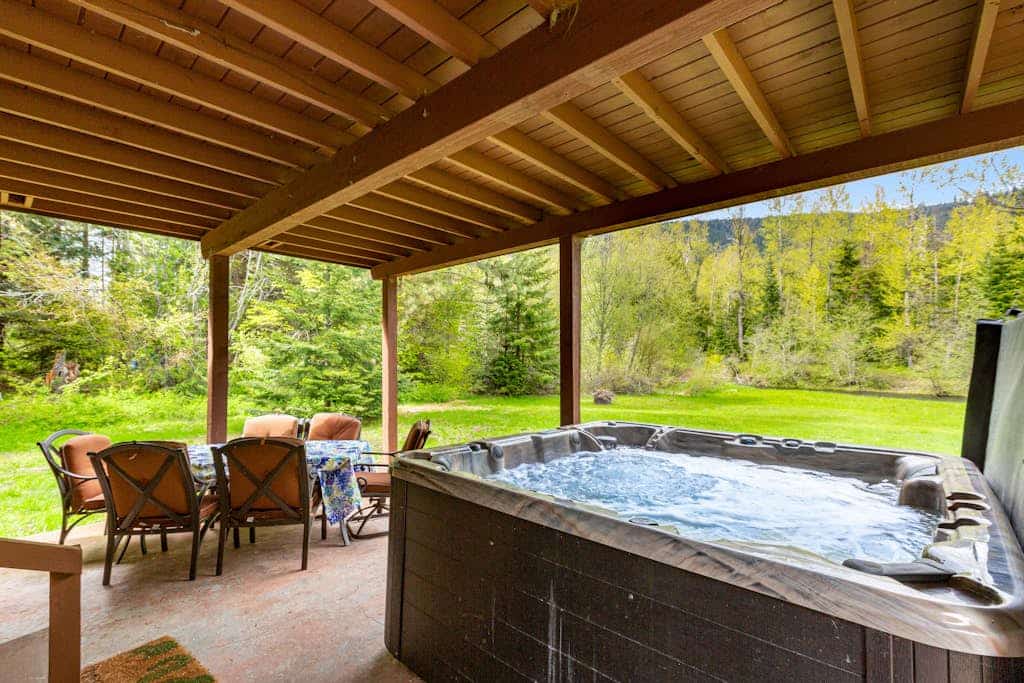 Dog-friendly riverfront home with hot tub, large yard, and fast Wifi