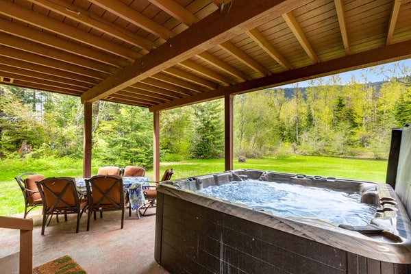 Dog-friendly riverfront home with hot tub, large yard, and fast Wifi