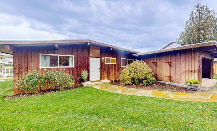 Bay-front dog-friendly home on one acre of land with modern interior & W/D