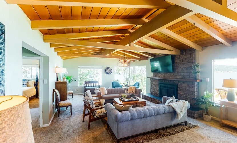 Inviting bayside dwelling with beach access, deck, waterfront views, & fireplace