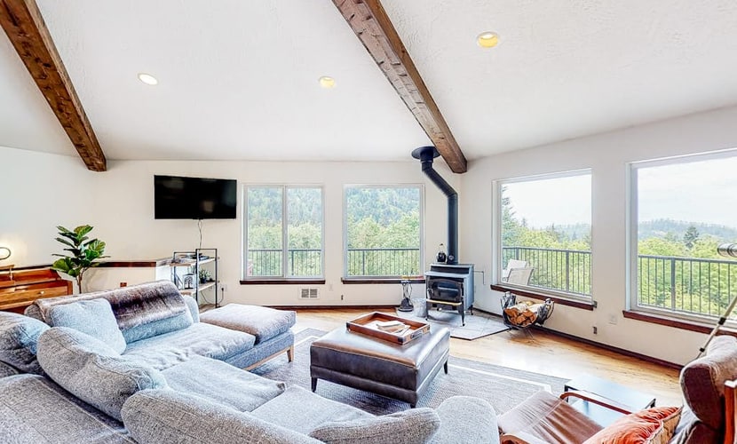 Idyllic home with water views, wrap-around deck, hot tub, and firepit - dogs ok