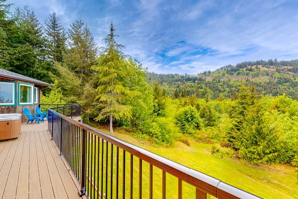 Idyllic home with water views, wrap-around deck, hot tub, and firepit - dogs ok