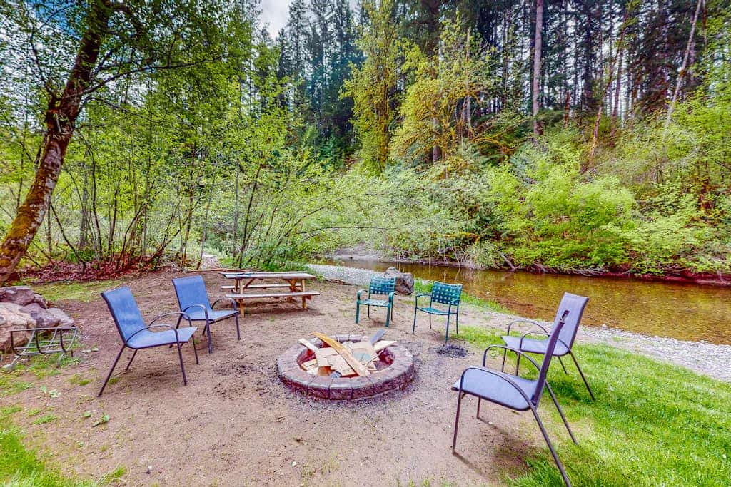 Riverfront property with three cabins, hot tubs, firepits, kayaks - beach access