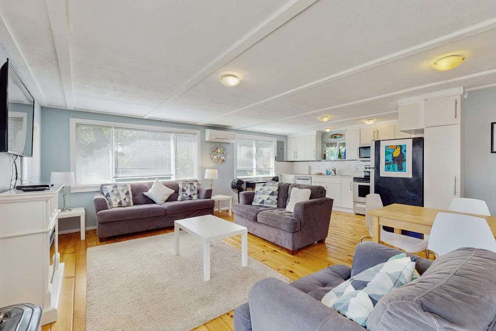 Cozy coastal cottage with modern kitchen, dog-friendly spaces, and beach access