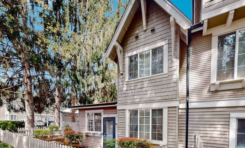 Light-filled corner townhome with deck, home office & convenient location