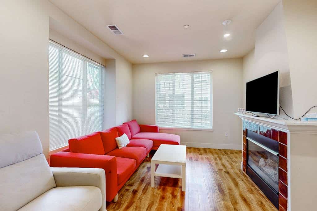 Light-filled corner townhome with deck, home office & convenient location
