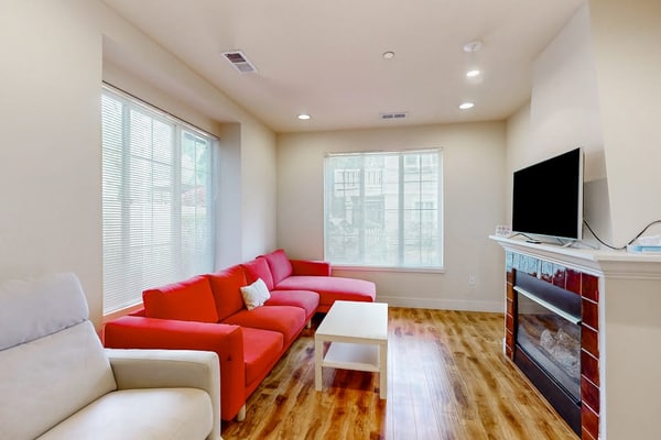 Light-filled corner townhome with deck, home office & convenient location