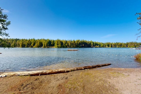 Water-view home & bunkhouse with lake access, canoe, kayaks, firepit, & W/D