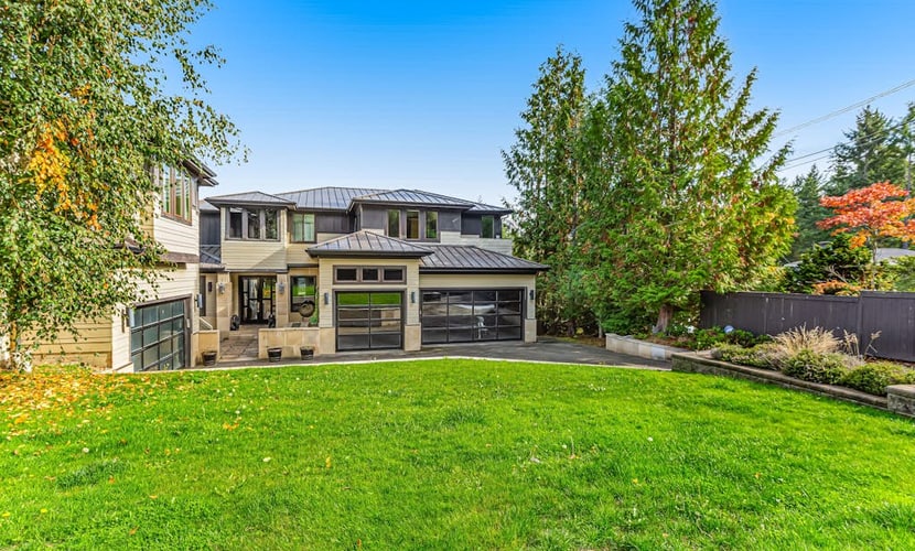 Upscale waterfront estate with private dock, fireplace, & gourmet kitchen