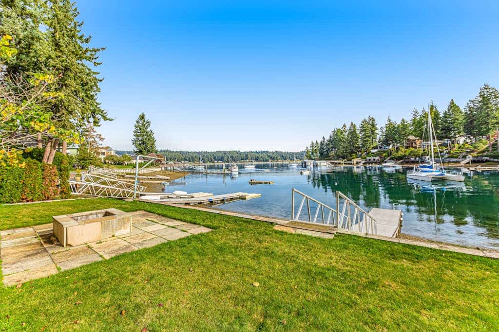 Upscale waterfront estate with private dock, fireplace, & gourmet kitchen