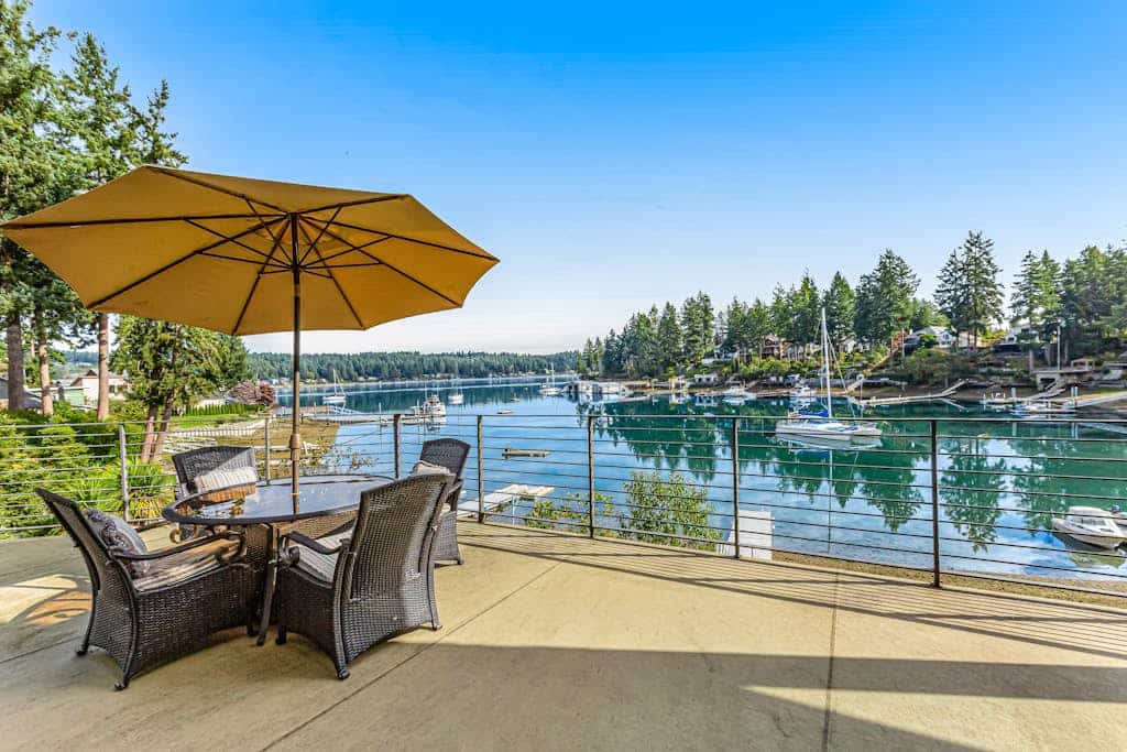 Upscale waterfront estate with private dock, fireplace, & gourmet kitchen