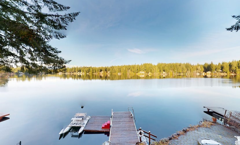 Lakefront studio-like home with beach access, lake views, wood stove, & firepit