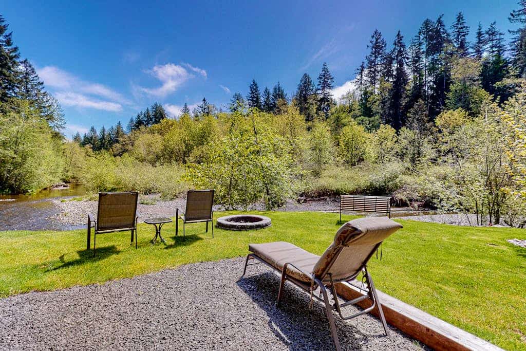 Inviting riverfront home with full kitchen, firepit, W/D, & dog-friendly