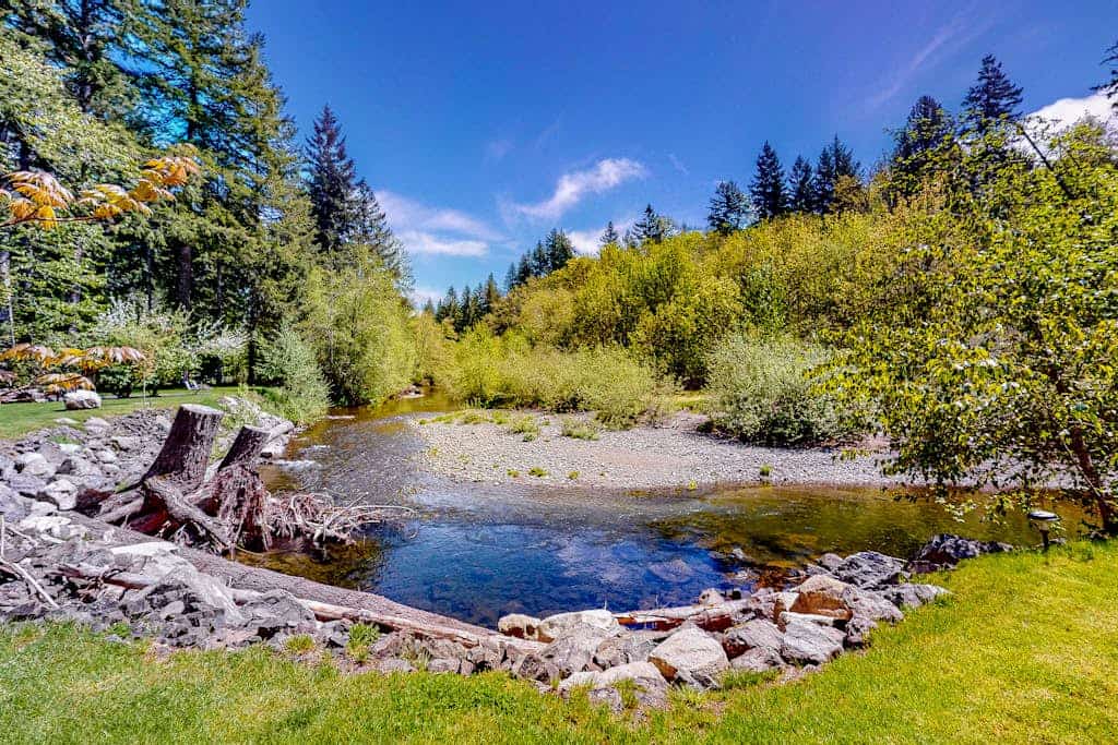 Inviting riverfront home with full kitchen, firepit, W/D, & dog-friendly
