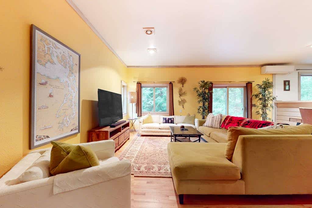 Tree-lined retreat with wood fireplace, board game collection, & pool access