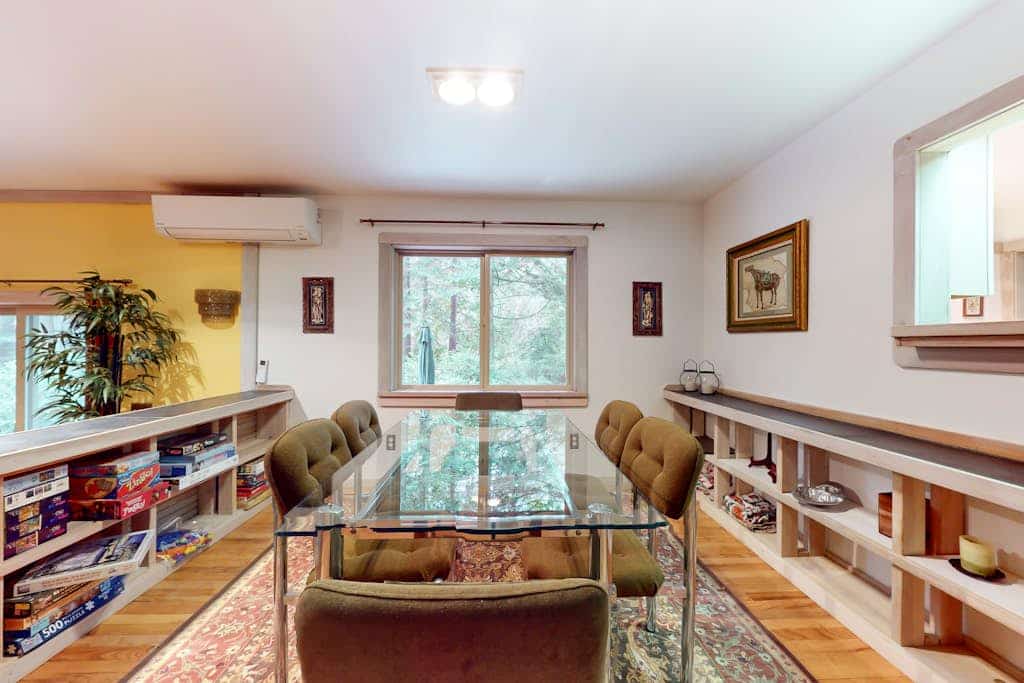 Tree-lined retreat with wood fireplace, board game collection, & pool access