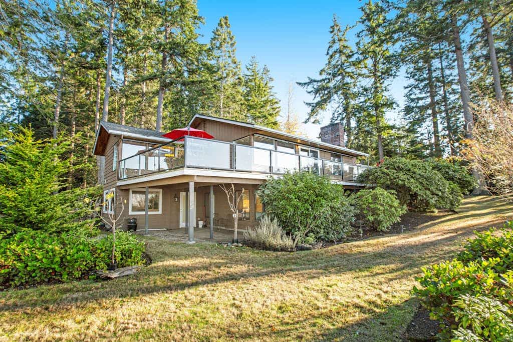 Updated sound front home with water & mtn views, fireplace, firepit, balcony