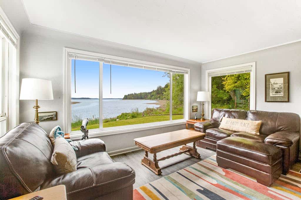 Waterfront retreat with private beach, firepit, kayaks/SUP, EV charger & grill
