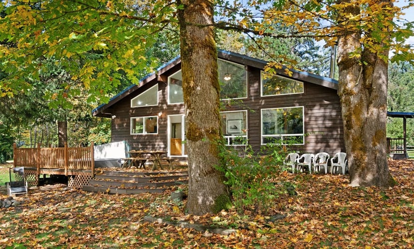 Dog-friendly riverfront cabin w/ Private Hot Tub, Wood Stove, near Ski resort