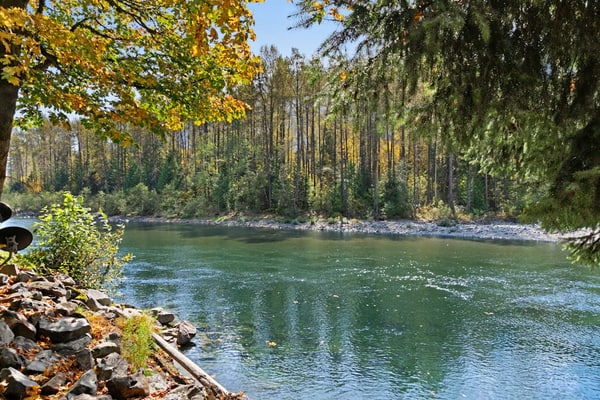 Dog-friendly riverfront cabin w/ Private Hot Tub, Wood Stove, near Ski resort
