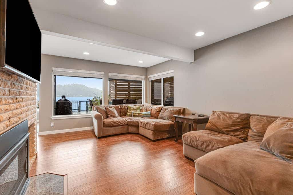Lakefront home with canoe, kayaks, large deck, beach access, fireplace, & W/D