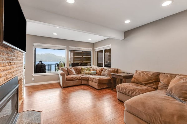 Lakefront home with canoe, kayaks, large deck, beach access, fireplace, & W/D
