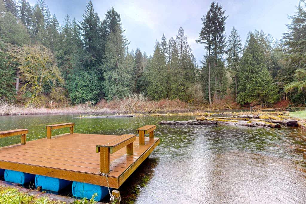Lakefront home with private dock, lake views, firepit, & wood stove