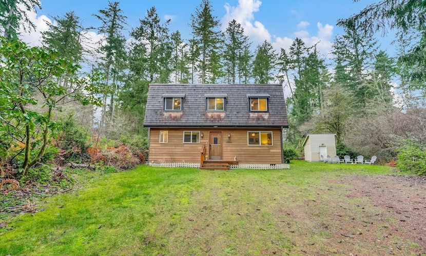 Dog-friendly storybook home in the trees with tennis, pickleball & beach access