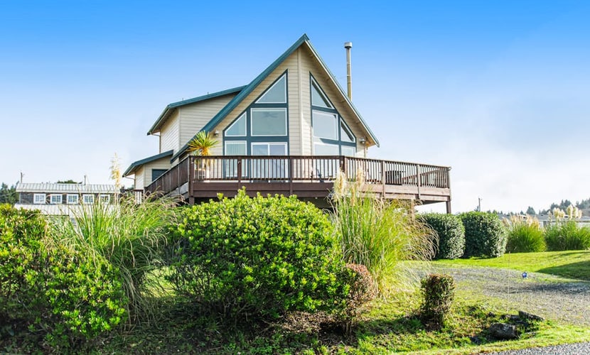 Spacious coastal home with private hot tub, ocean view, wood stove & EV charging