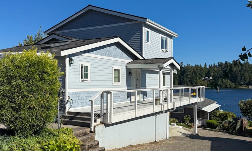 Centrally located waterfront home with ocean view, home office, grill, fireplace