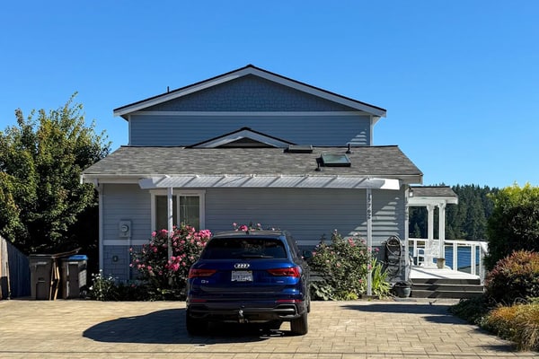 Centrally located waterfront home with ocean view, home office, grill, fireplace