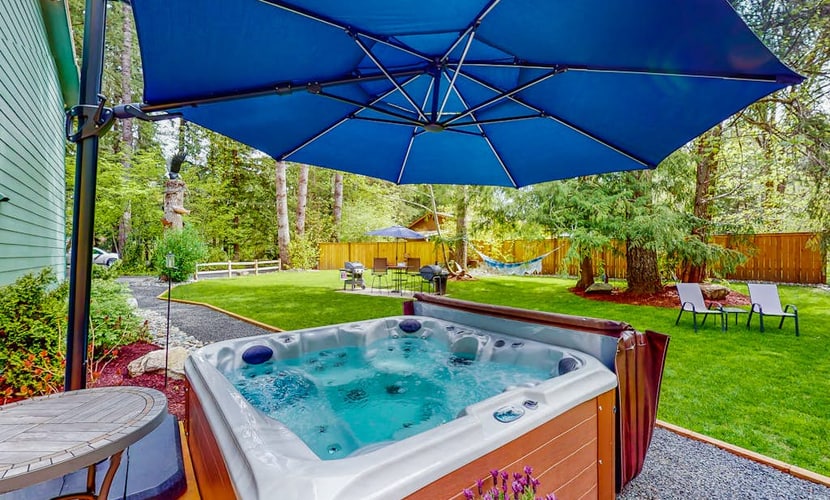 Inviting riverfront home with hot tub, firepit, W/D, & dog-friendly