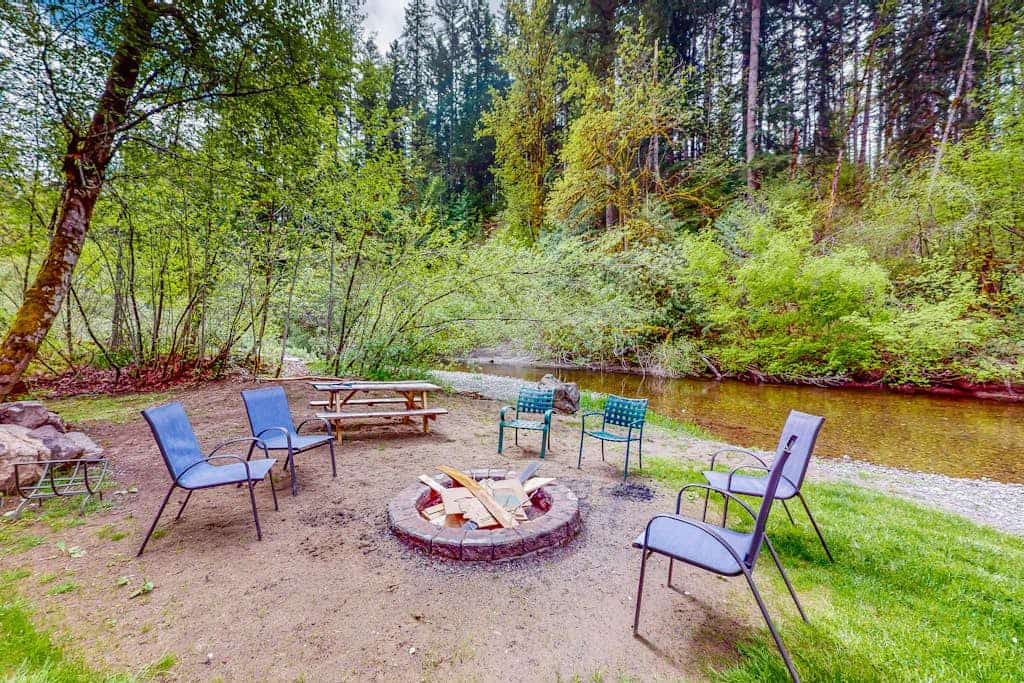 Inviting riverfront home with hot tub, firepit, W/D, & dog-friendly