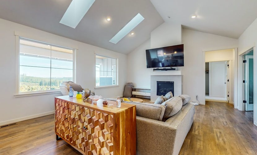 Modern home with fireplace, private patio, remote workspace, & golf nearby