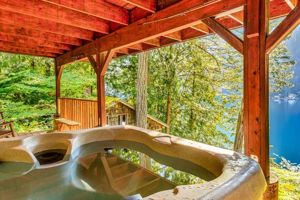 Lakefront home with stunning views, private hot tub, dock & 2-story deck