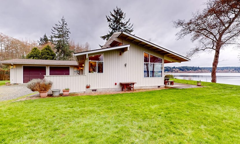 Stunning waterfront escape with patio, beach access, & gorgeous bay views